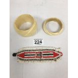 TWO CARVED IVORY BANGLES AND A BEAD NECKLACE