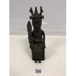 A BENIN BRONZE FIGURE OF A CHIEF SAT UPON A THRONE HOLDING A SPEAR, 26.5CM HIGH