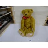 A LARGE LIMITED EDITION MERRYTHOUGHT TEDDY BEAR PURCHASED FROM HAMLEYS, COMES WITH ORIGINAL RECEIPT,