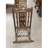 A VINTAGE HARDWOOD KGOLTA FOLDING CHAIR WITH STRINGED BASE FROM BOTSWANA