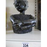 A HEAVY STONE AND PLASTER CARVED FIGURE OF AN AFRICAN LADY, 42CM HIGH
