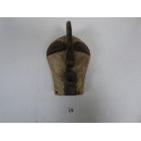 A VINTAGE CARVED TRIBAL ART ZAIRE MASK, 32CM IN LENGTH