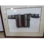 A FRAMED AND GLAZED PRINT OF A TRIBAL SWEATER/TOP, 67.5CM BY 56CM