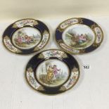 A SET OF THREE SEVRES STYLE PORCELAIN PLATES, THE FRONTS DECORATED WITH SCENES OF FIGURES IN A