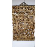 A CHINESE HEAVILY CARVED WOODEN WALL PLAQUE DEPICTING A SCENE WITH AN EMPORER WITH HIS PEOPLE, GILT,