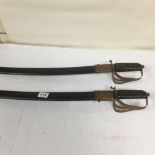 TWO MIDDLE EASTERN SWORDS IN SCABBARDS