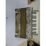 AN ALVARI ACCORDIAN WITH MOTHER OF PEARL STYLE DECORATION