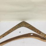 TWO AUSTRALIAN BOOMERANGS, ONE WITH PAINTED DECORATION OF NATIVE ANIMALS, LARGEST 73CM WIDE