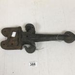 FOUR 19TH CENTURY CAST IRON DOOR BRACKETS, 39CM WIDE