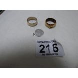 A SILVER BAND RING, A YELLOW METAL BUCKLE RING AND A WHITE METAL ST CHRISTOPHER PENDANT