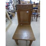 A MID CENTURY CARVED OAK CHURCH CHAIR WITH INSCRIPTION TO THE BACK, DATED 1947-1954, 99CM HIGH