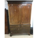 A LARGE 19TH CENTURY MAHOGANY WARDROBE, THE TWO DOORS ABOVE TWO FALSE SHORT DRAWERS AND TWO REAL