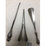 A SET OF SILVER HANDLED GLOVE STRETCHERS, A SIMILAR SHOEHORN AND A BUTTON HOOK