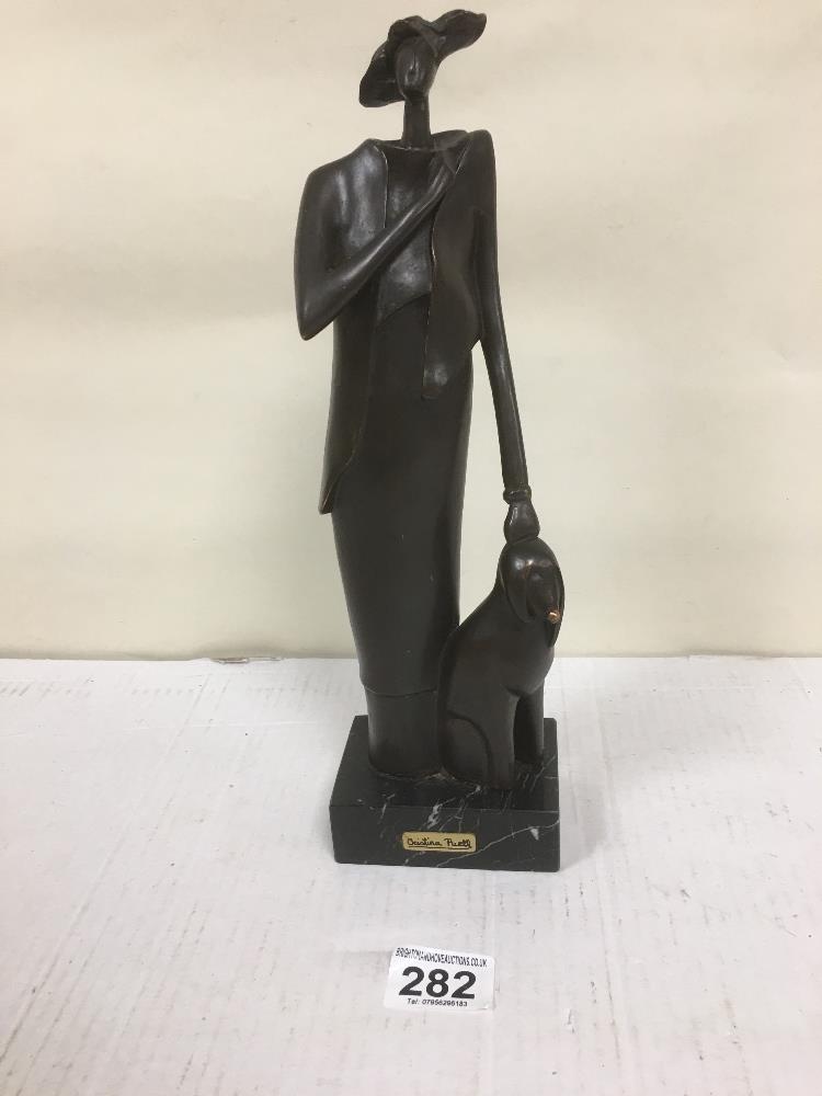 CHRISTINA PUELL, SPANISH ART DECO STYLE FIGURE OF A WOMEN AND A DOG, RAISED UPON MARBLE BASE, 33CM