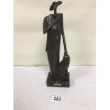 CHRISTINA PUELL, SPANISH ART DECO STYLE FIGURE OF A WOMEN AND A DOG, RAISED UPON MARBLE BASE, 33CM