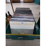 A LARGE COLLECTION OF VINYL RECORDS AND ALBUMS IN A CRATE