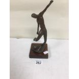 A BRONZE FIGURE OF A FOOTBALLER ABOUT TO STRIKE THE BALL, INDISTINGCTLY SIGNED TO THE BASE, 27.5CM