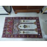 A MIDDLE EASTERN PRAYER RUG, 160CM BY 93CM