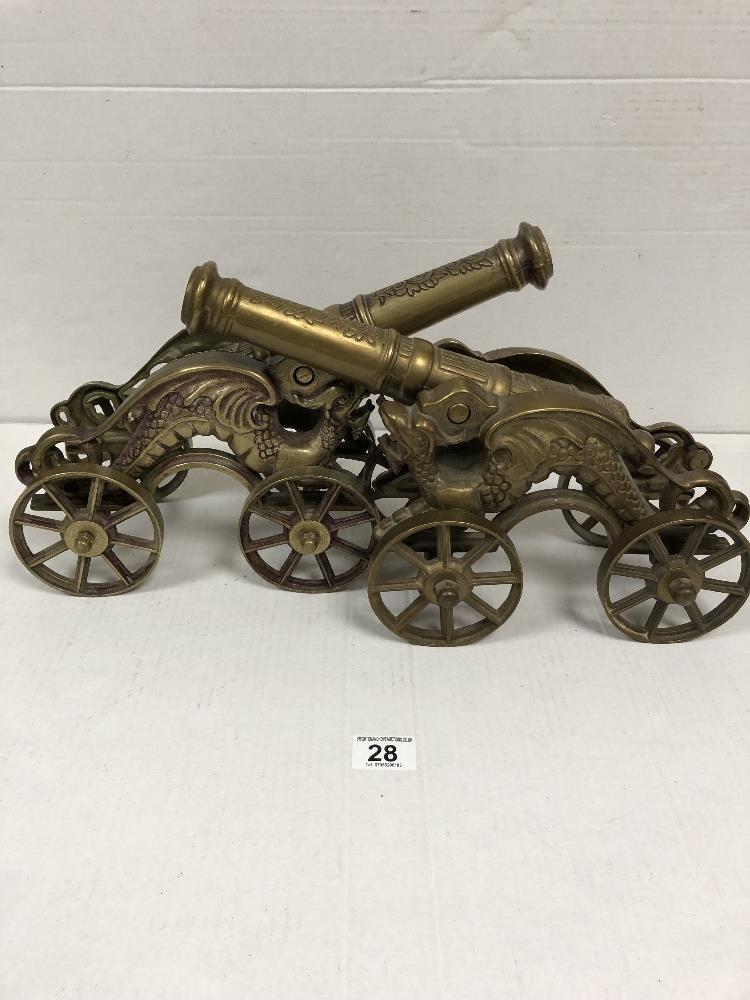 TWO HEAVY DECORATIVE BRASS CANONS WITH DRAGONS TO THE SIDES