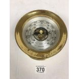 A VINTAGE BRASS CASED CHELSEA BAROMETER OF CIRCULAR FORM, 14.5CM DIAMETER