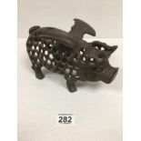 AN UNUSUAL PAINTED METAL FIGURE OF A FLYING PIG, PIERCED DETAILING THROUGHOUT, 26CM WIDE