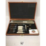 A GUNMASTER UNIVERSAL CLEANING SET IN ORIGINAL FITTED WOODEN BOX