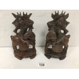 TWO ORNATLEY CARVED FIGUIRES WITH ANIMALS