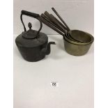 A GRADUATORS BRASS SET OF PANS WITH A VICTORIAN KETTLE