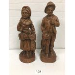 TWO WOODEN CARVED FIGURES WITH ANIMALS