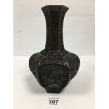 AN UNUSUAL HEAVILY CARVED CHINESE VASE OF HEXAGONAL BALUSTER FORM, 25CM HIGH