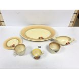 SIX PIECES OF CLARICE CLIFF 'CROCUS' PATTERN CERAMICS, COMPRISING THREE CUPS, A SAUCER, GRAVY BOAT