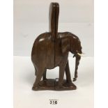 AN AFRICAN CARVED WOODEN SET OF BOOKENDS IN FORM OF AN ELEPHANT WITH REAL BONE TUSKS, 33CM HIGH