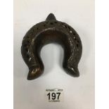 AN UNUSUAL EARLY ORIENTAL PIERCED BRONZE CEREMONIAL TORQUE, U SHAPED WITH SPLAYED BASE, 14CM BY 12.