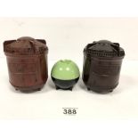 A PAIR OF 1930'S BAKELITE TEA & COFFEE CADDIES OF CYLINDRICAL FORM, BOTH RAISED ON THREE POINTED
