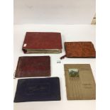 A LARGE ALBUM OF EARLY 20TH CENTURY POETICAL POSTCARDS, TOGETHER WITH FOUR CIGARETTE CARD ALBUMS