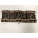 AN EARLY HINDU CARVED WOODEN WALL PLAQUE DEPICTING GANESH AMONGST OTHER FIGURES, 60CM WIDE