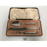 A WHITE METAL HANDLED THREE PIECE CARVING SET BY SHARMAN O'NEILL, COMPRISING KNIFE, SPOON AND