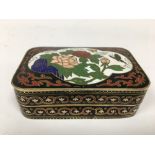 AN ORIENTAL CLOISONNE ENAMEL LIDDED BOX OF RECTANGULAR FORM AND A CLOISONNE HANDLED POURING VESSEL