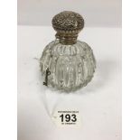 A LARGE LATE VICTORIAN SILVER TOPPED CUT GLASS TOILETRIES BOTTLE OF OVOID FORM, HALLMARKED