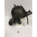 AN ANTIQUE LOBSTER TAIL METAL MILITARY HELMET, 43CM BY 28CM