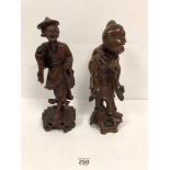 AN ANTIQUE ROSEWOOD CARVED FIGURE OF AN EASTERN ORIENTAL MAN AND ANOTHER LATER VINTAGE EXAMPLE