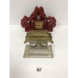 A FRENCH RED PAINTED CERAMIC MANTLE CLOCK BY SCOUT, 31CM WIDE, TOGETHER WITH A GILT METAL STAMP