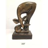 A LARGE EXPRESSIONIST AFRICAN SOAPSTONE SCULPTURE OF TWO ANTELOPE, RAISED ON A WOODEN BASE, 36CM