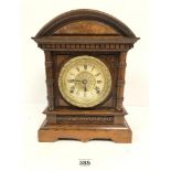 AN OAK CASED MANTLE CLOCK BY SETH THOMAS, MADE IN THE USA, THE DIAL WITH ROMAN NUMERALS DENOTING