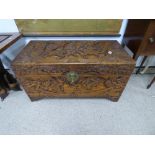 HEAVILY CARVED CAMPHOR WOODEN CHEST WITH CARVED FI