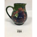 A MOORCROFT POTTERY FINCH PATTERN POURING JUG OF OVOID FORM, PAINTED AND IMPRESSED FACTORY MARKS