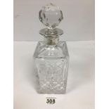 A SILVER MOUNTED CUT GLASS WHISKY DECANTER WITH STOPPER, ETCHING TO TOP DATED 1995, 27.5CM HIGH