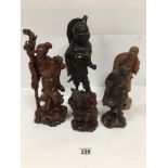 A GROUP OF FIVE ORIENTAL CARVED WOODEN FIGURES ALL DEPICTING ELDERLY MEN, VARYING SHAPES AND