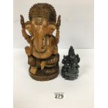 TWO CARVED FIGURES OF THE HINDU GOD GANESH, ONE CARVED OUT OF WOOD, THE OTHER STONE, LARGEST 26CM