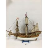 A WOODEN TWO MASTED CLIPPER SHIP ON STAND, 63CM LONG